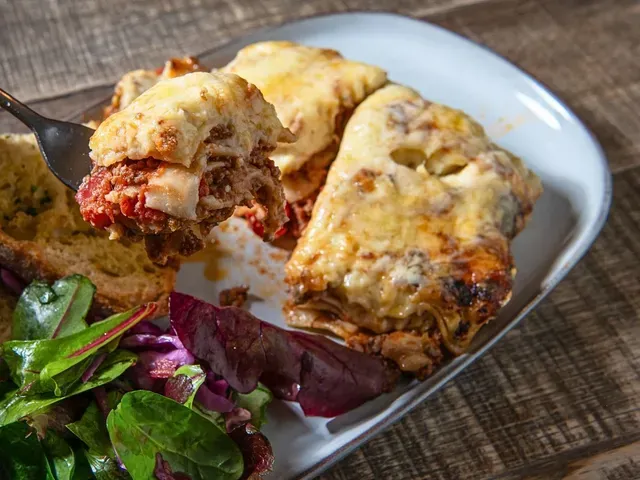 Beef lasagne with garlic bread and salad